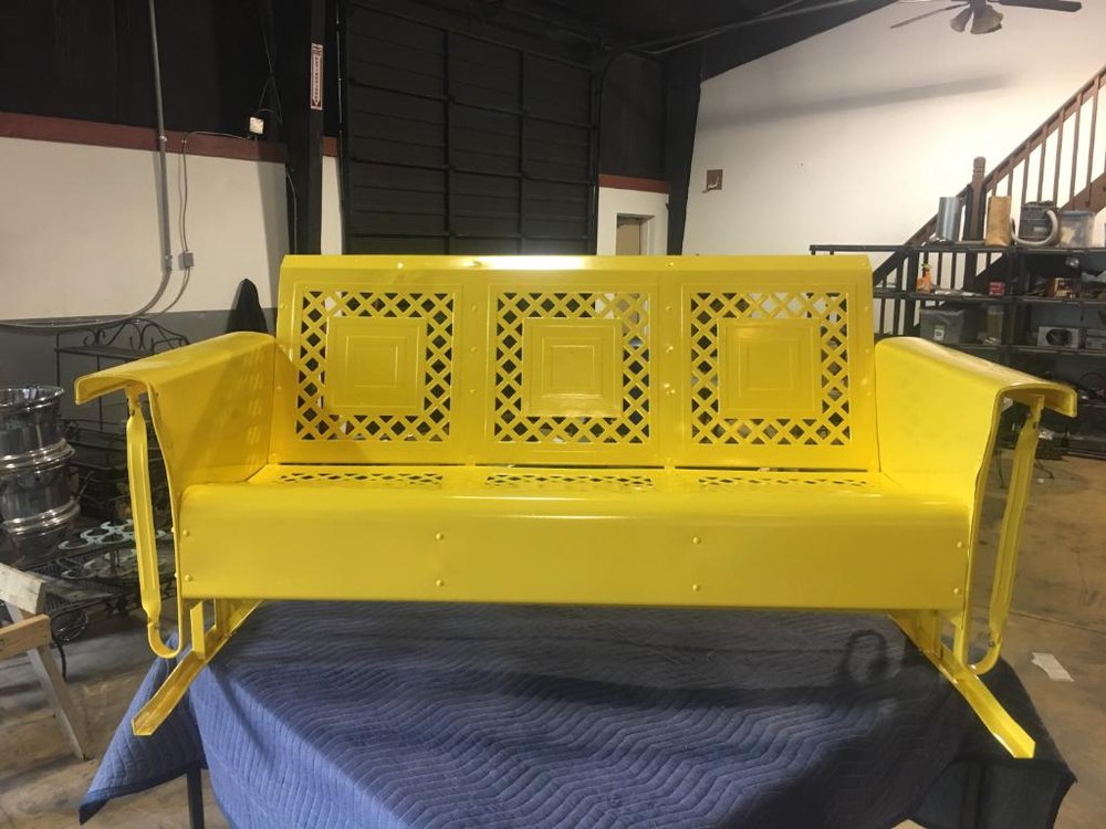 Vintage metal patio glider bench powder-coated safety yellow by Superior Powder Coating