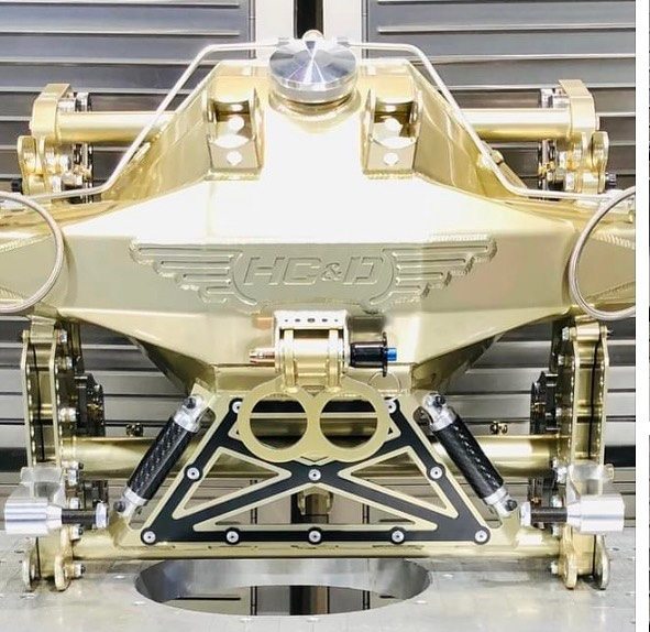 Custom tubular frame powder coated metallic gold flake — a premium multi-stage finish