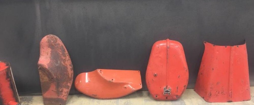 Set of vintage motorcycle tank and fender parts powder-coated candy red by Superior Powder Coating