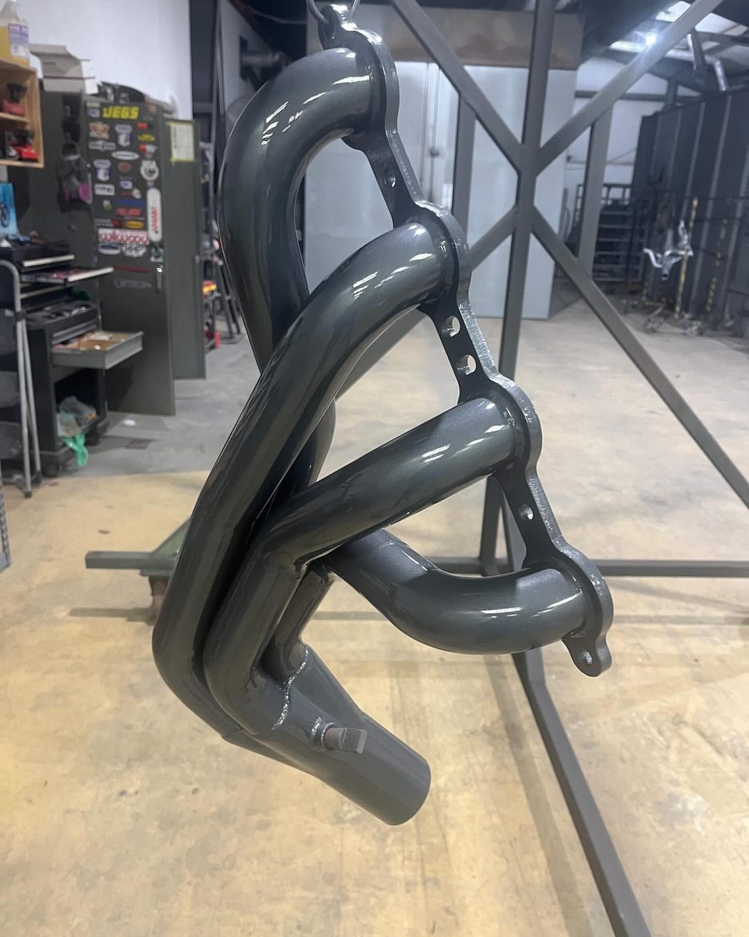 Custom tubular exhaust header powder-coated satin black by Superior Powder Coating