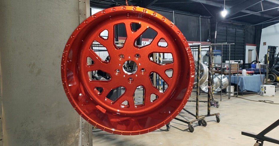 Multi-spoke wheel powder-coated deep red by Superior Powder Coating